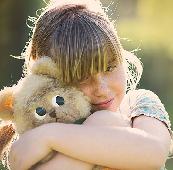 Donate clothing and comfort child with stuffed animal